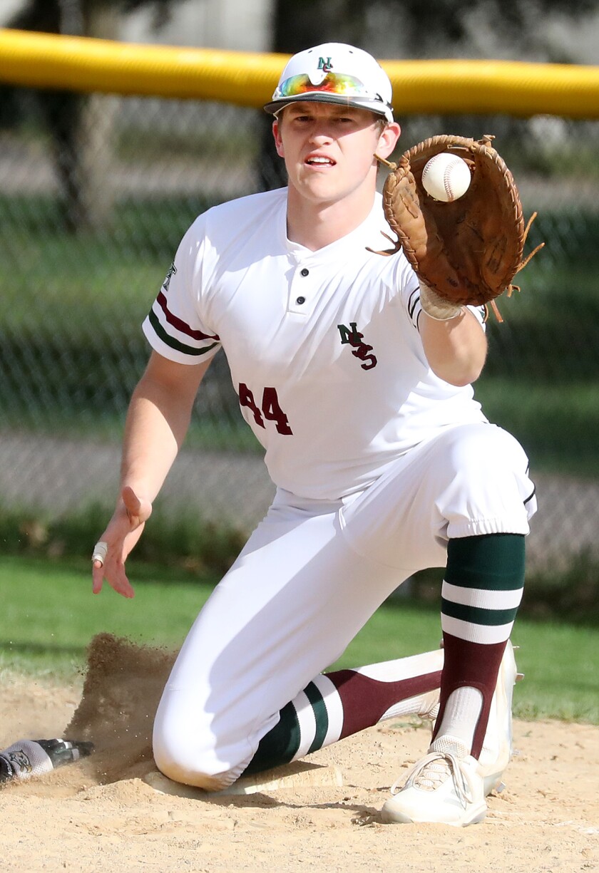Brady Krmpotich (44) of Northwood/Solon Springs catches the ball at first base