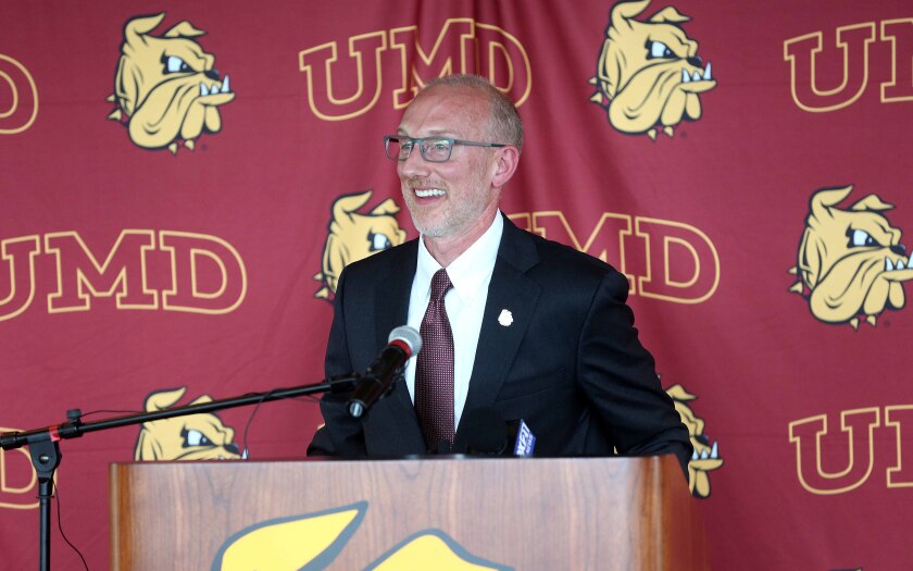 New Minnesota Duluth Athletic Director Forrest Karr smiles.