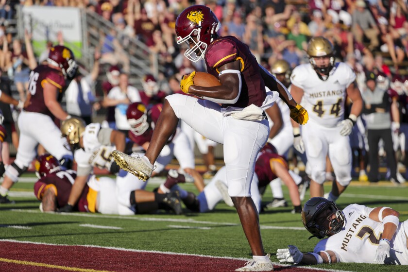 Football player playing in outdoor stadium