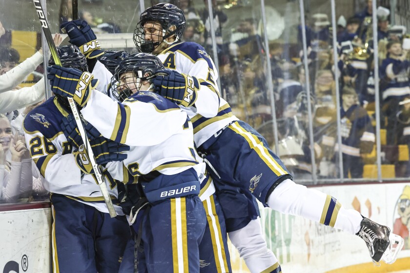 high school boys play ice hockey