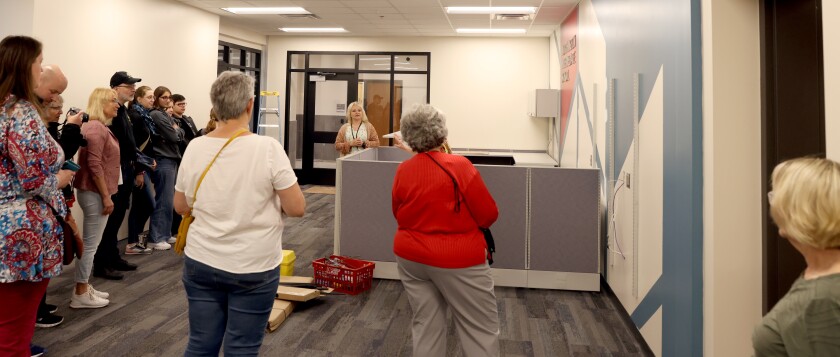 Principal Katie Clarke speaks to a group from Crailsheim, Germany, during a tour of the Intermediate School Friday, June 10, 2022, that included its new main office.