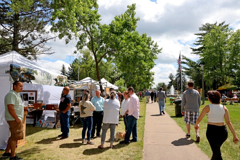 People attend Arts in the Park on Sunday, June 26, 2022, at Gregory Park in Brainerd.