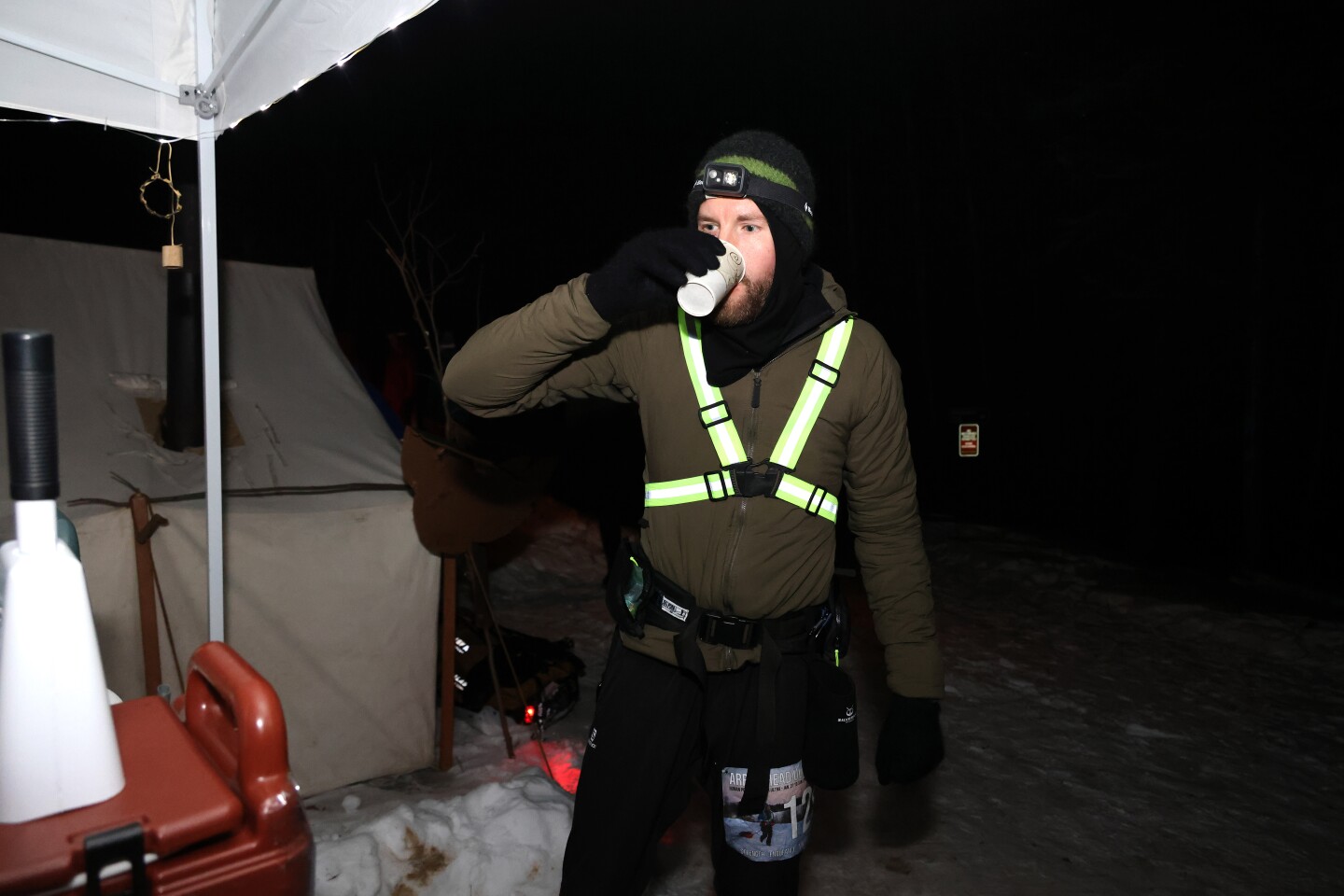 Racer drinks lemonade at checkpoint