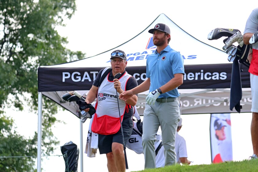 Andrew Israelson hands off a club after teeing off on Friday, Aug. 29, 2025, during the PGA Tour Americas CRMC Championship presented by Northern Pacific Center at Cragun's Legacy Courses.