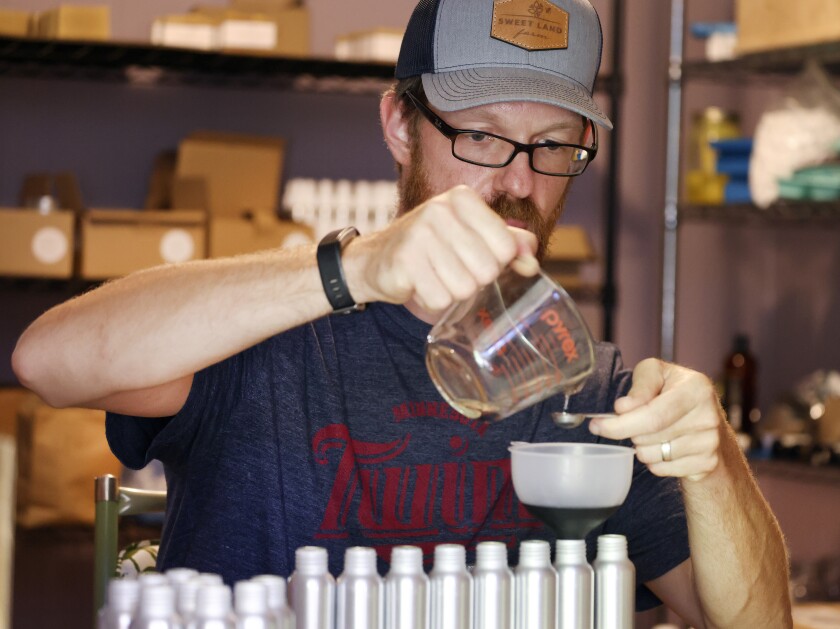 Man measuring fluid.