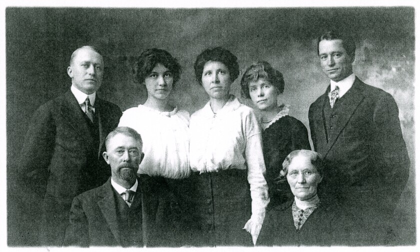 The Thomas and Emma Bush family is depicted in 1909. Archie Bush is on the far left.