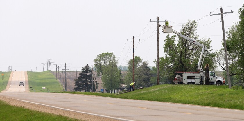 Nobles Cooperative Electric replacing power poles and repairing lines Monday afternoon along Hwy 91after severe storms hit the Ellsworth and Rushmore area in the middle of the night.