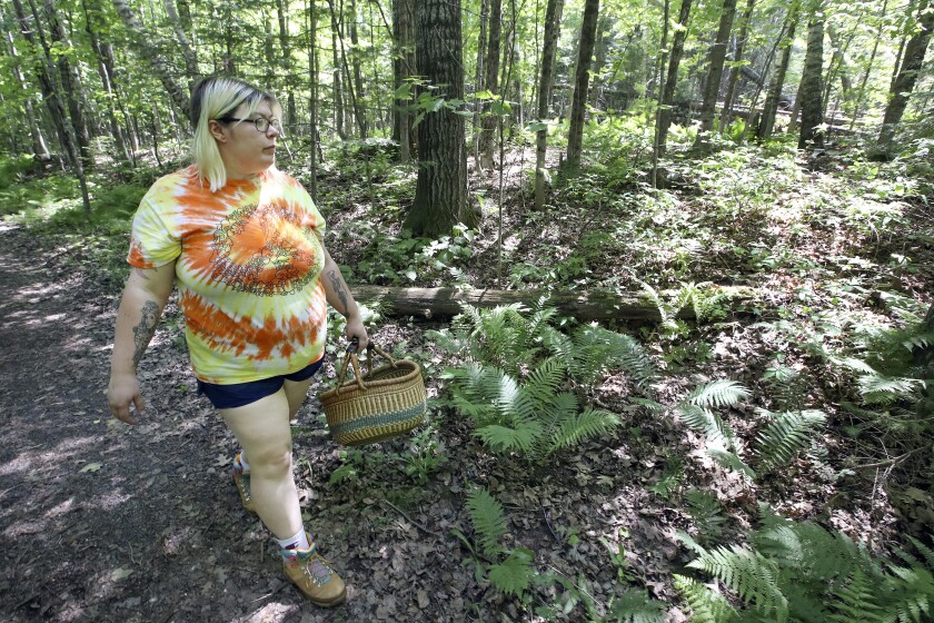 Woman walking in the woods.