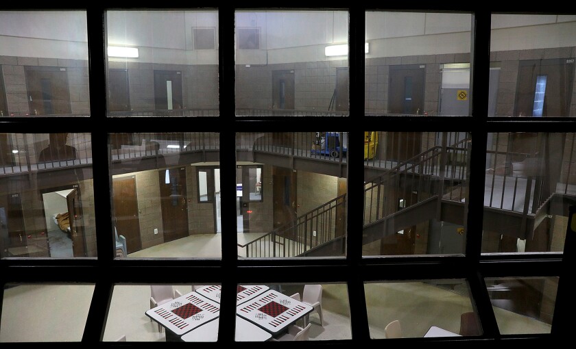 Windows from a secured area look over one of the common areas for women at the St. Louis County Jail