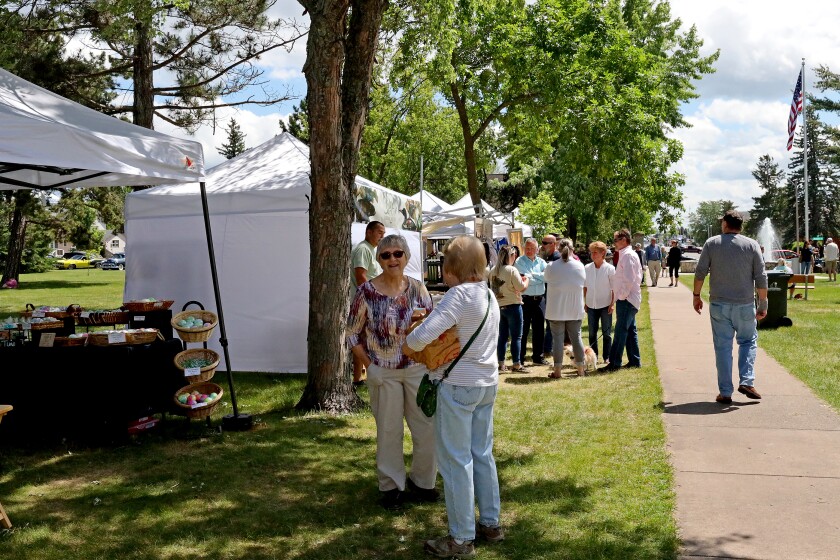 People attend Arts in the Park on Sunday, June 26, 2022, at Gregory Park in Brainerd.