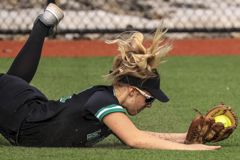 High school athletes playing softball