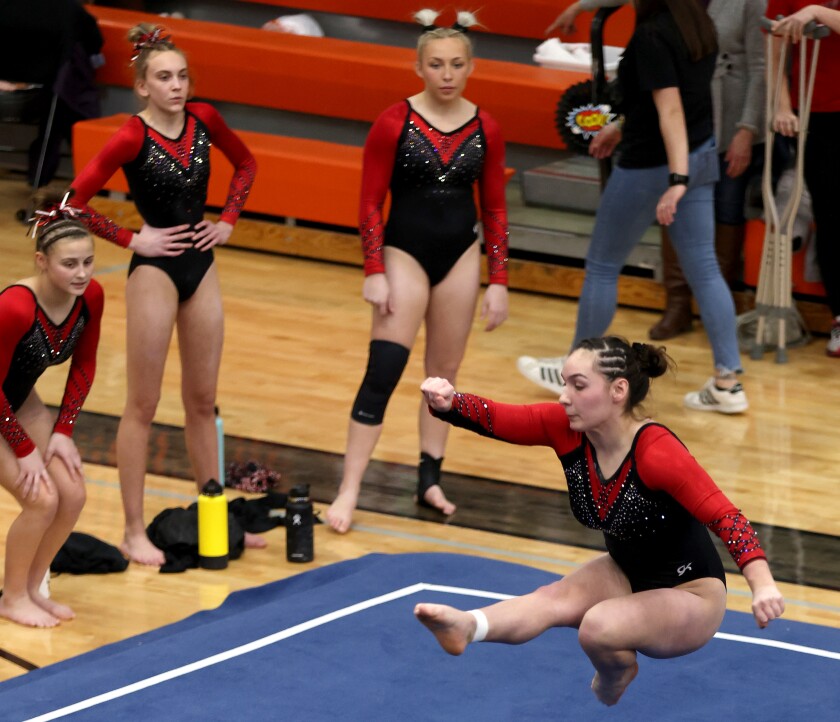 Worthington Trojans Mekyla Nystrom rotates through an element of her floor routine during section 3A gymnasts tenement action Saturday in Marshall Minnesota.