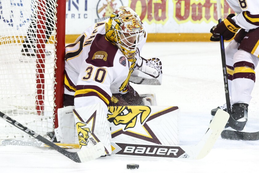 college men play ice hockey