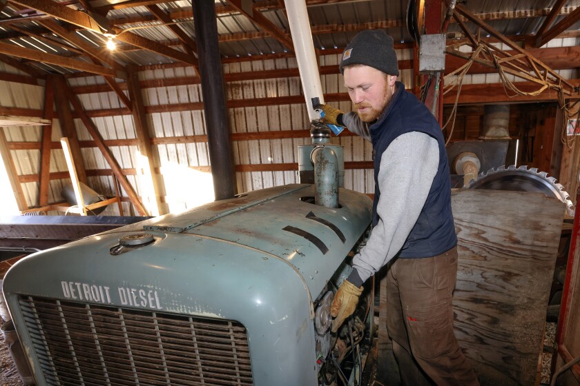 Man starting a diesel engine.