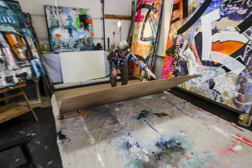 A family creates abstract paintings together in a home studio
