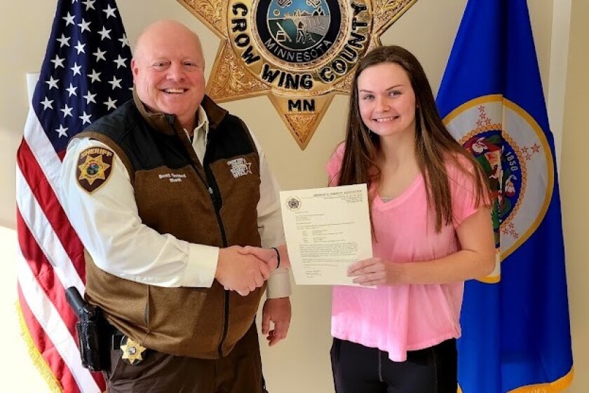 Crow Wing County Sheriff Scott Goddard and Central Lakes College student Jenna Lawin.