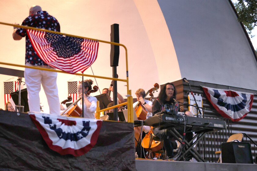 Paul Summers LaRoche joins the Worthington Area Symphony Orchestra during the Wind, Water & WOW celebration at Chautauqua Park Monday evening, July 4, 2022.