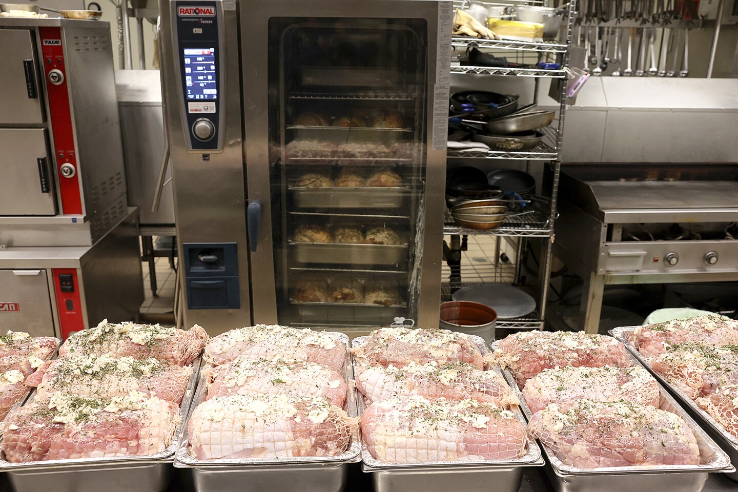 Turkey rest in pans near oven.