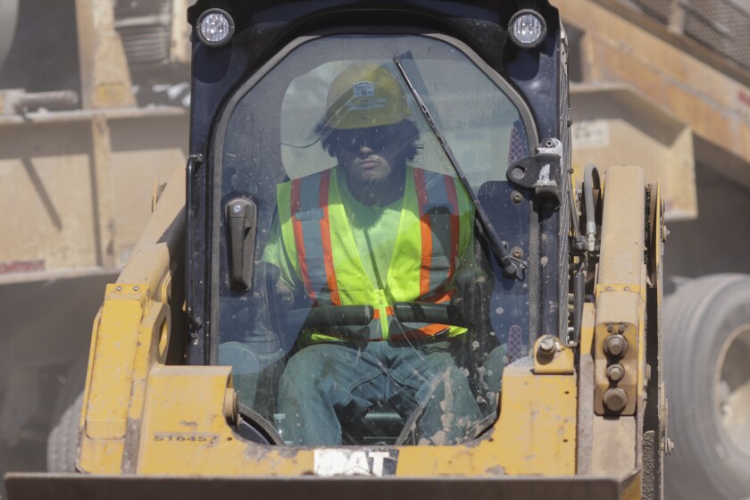 Man is safety clothing working at aggregate mine