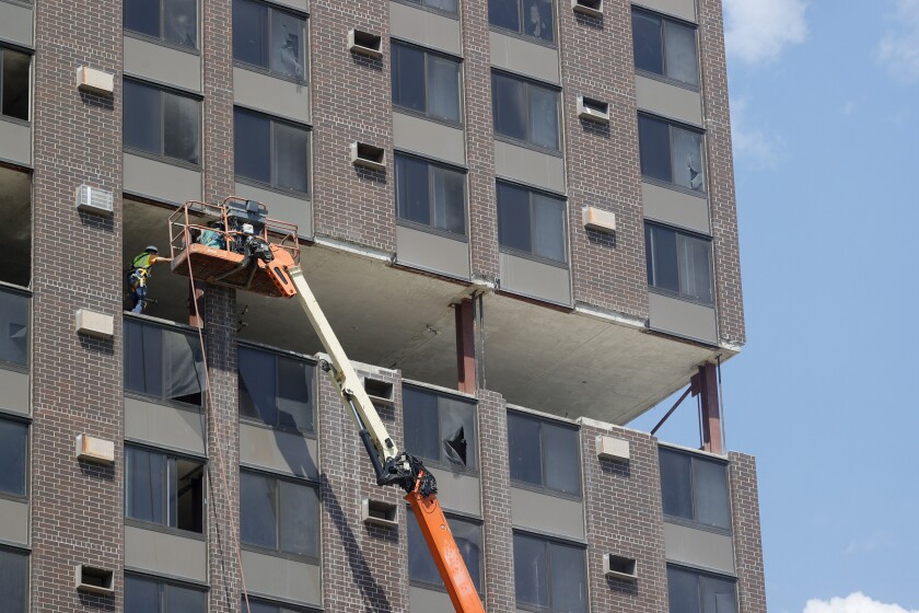 Sky peeks through Fargo high-rise as it's stripped down ahead of ...