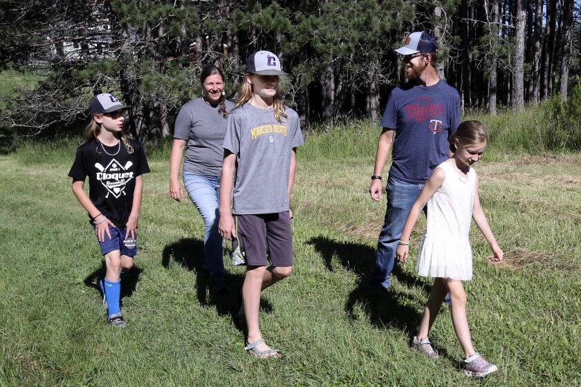 Family walking on their farm.