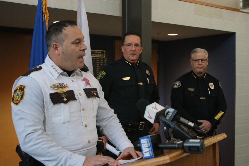 West Fargo Police Chief Todd Otterness and Fargo Police Chief David Zibolski look on as Cass County Sheriff Jessie Jahner speaks during a press conference Sunday, Oct. 31, 2021.jpg