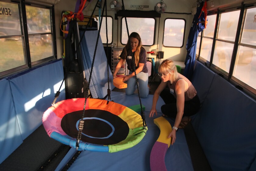 Bobbie Sunderland, left, and Stacey Reek, preparing the Beyond Boundaries Therapy bus for therapy sessions in Milnor, ND on Sept.  8, 2022.jpg