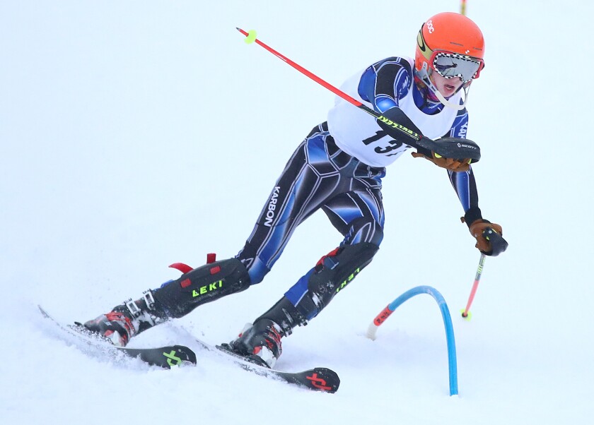 Hibbing’s Logan Maxwell (137) bends a gate during his run