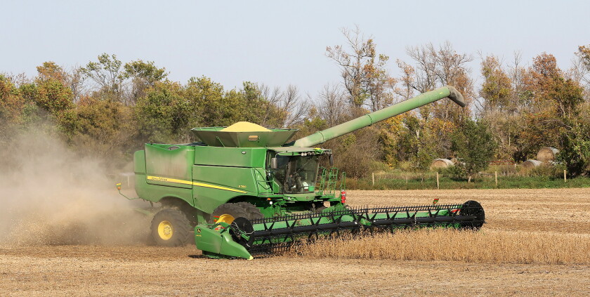 Combines Sun Good weather expedites soybean harvest, but farmers face market woes ...