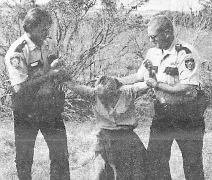 A photograph of Donna Leppert, 11 years old at the time, being taken to her father Tim Leppert, according to the Winrod Letters..jpg