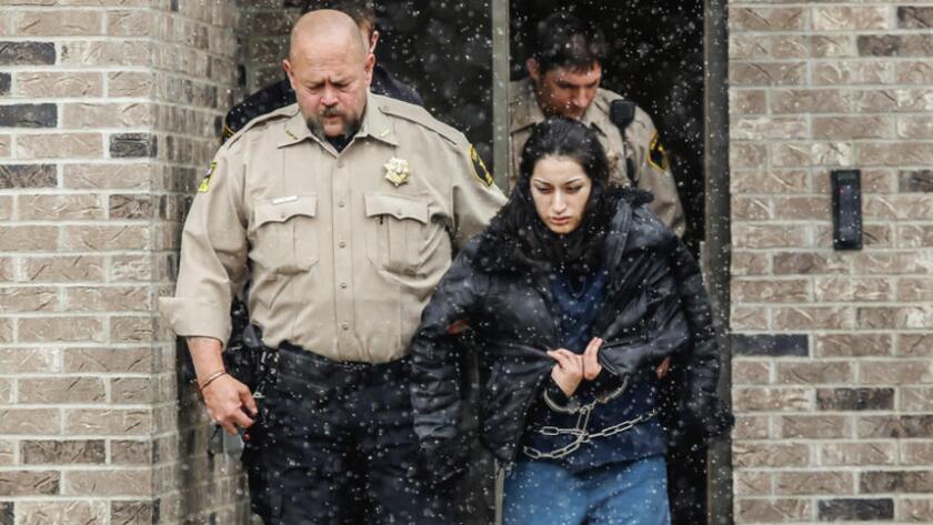 Maricela Diaz is escorted out of the Hanson County Courthouse in Alexandria by Hanson County Sheriff Randy Bartlett after being sentenced for 80 years in this March 2015 photo. Diaz was found guilty in January for the murder and kidnapping of Jasmine Guevara that occurred in 2009. (Matt Gade/Republic)