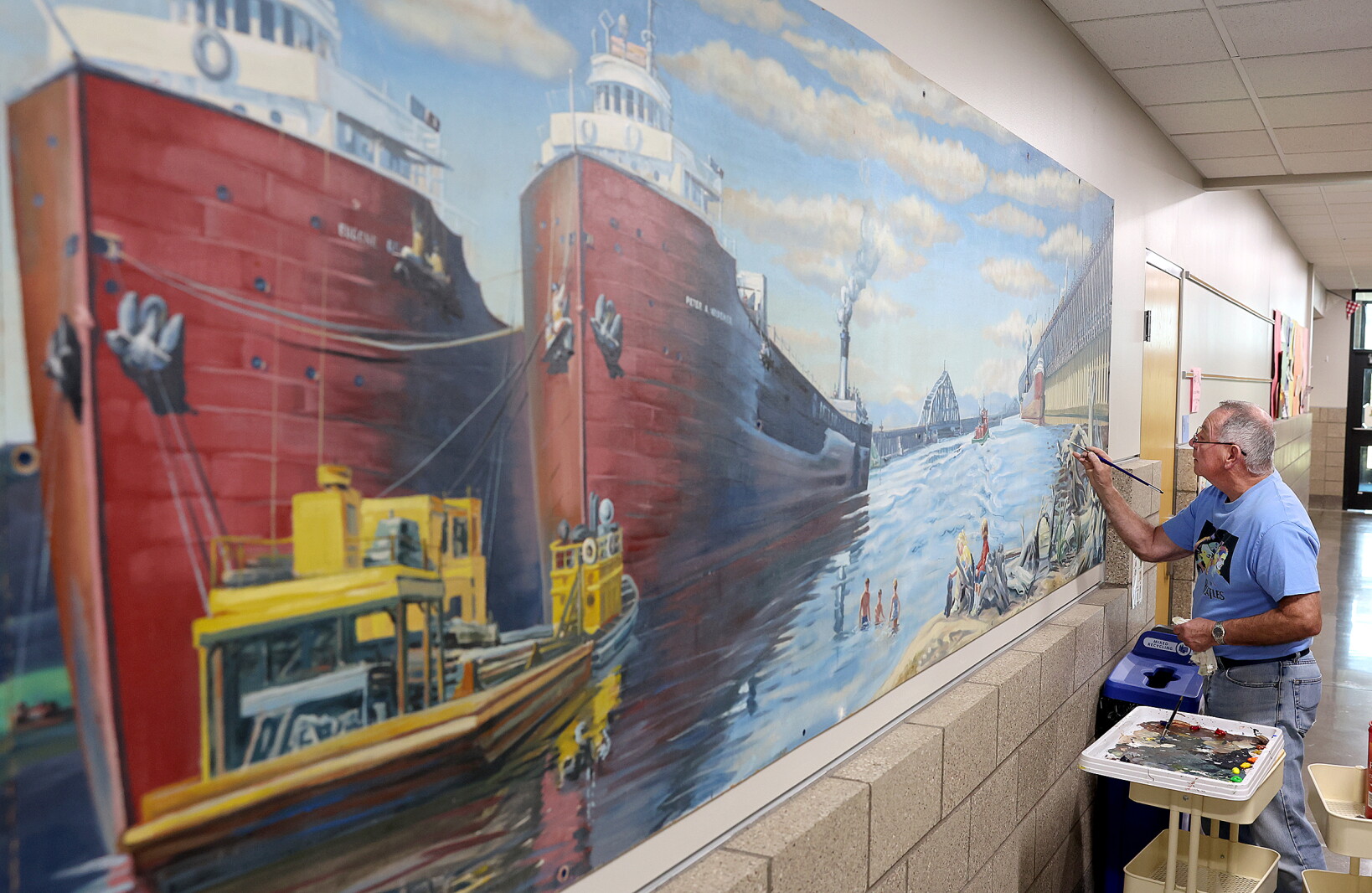 Artist restores mentor's work at Superior High School