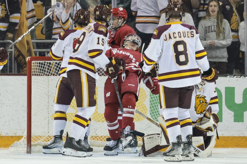 college hockey players play ice hockey
