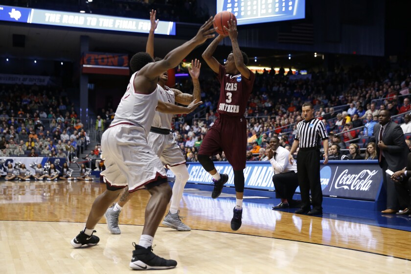 Mar 14, 2018; Dayton, OH, USA; Texas Southern Tigers guard Demontrae Jefferson (3) shoots in the first half against the North Carolina Central Eagles during the First Four of the 2018 NCAA Tournament at Dayton Arena. Mandatory Credit: Brian Spurlock-USA TODAY Sports