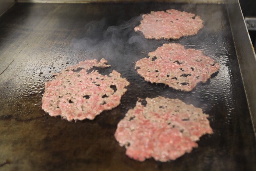 Chef preparing hamburgers