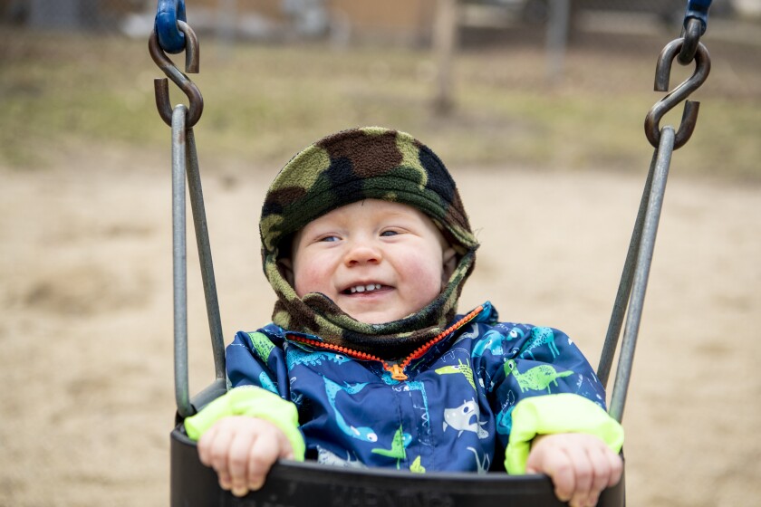Owen Martini, 10 months, smiles while swinging at Canigo Park in downtown Willmar on Thursday, April 28, 2022.