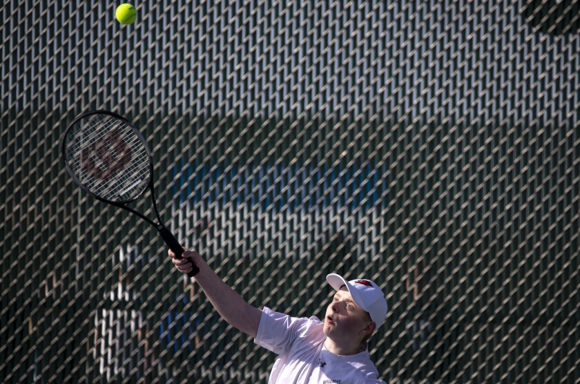 Ryan Newberg of Willmar eyes the ball while taking on the No. 2 doubles of Brainerd with teammate Jonathan Kelpe on Tuesday, April 26, 2022, in Willmar.