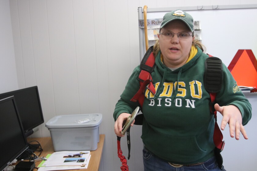 Angie Johnson, NDSU Extension Farm and Ranch Safety Coordinator, discusses farm safety measures in her office on Friday, December 17, 2021.jpg