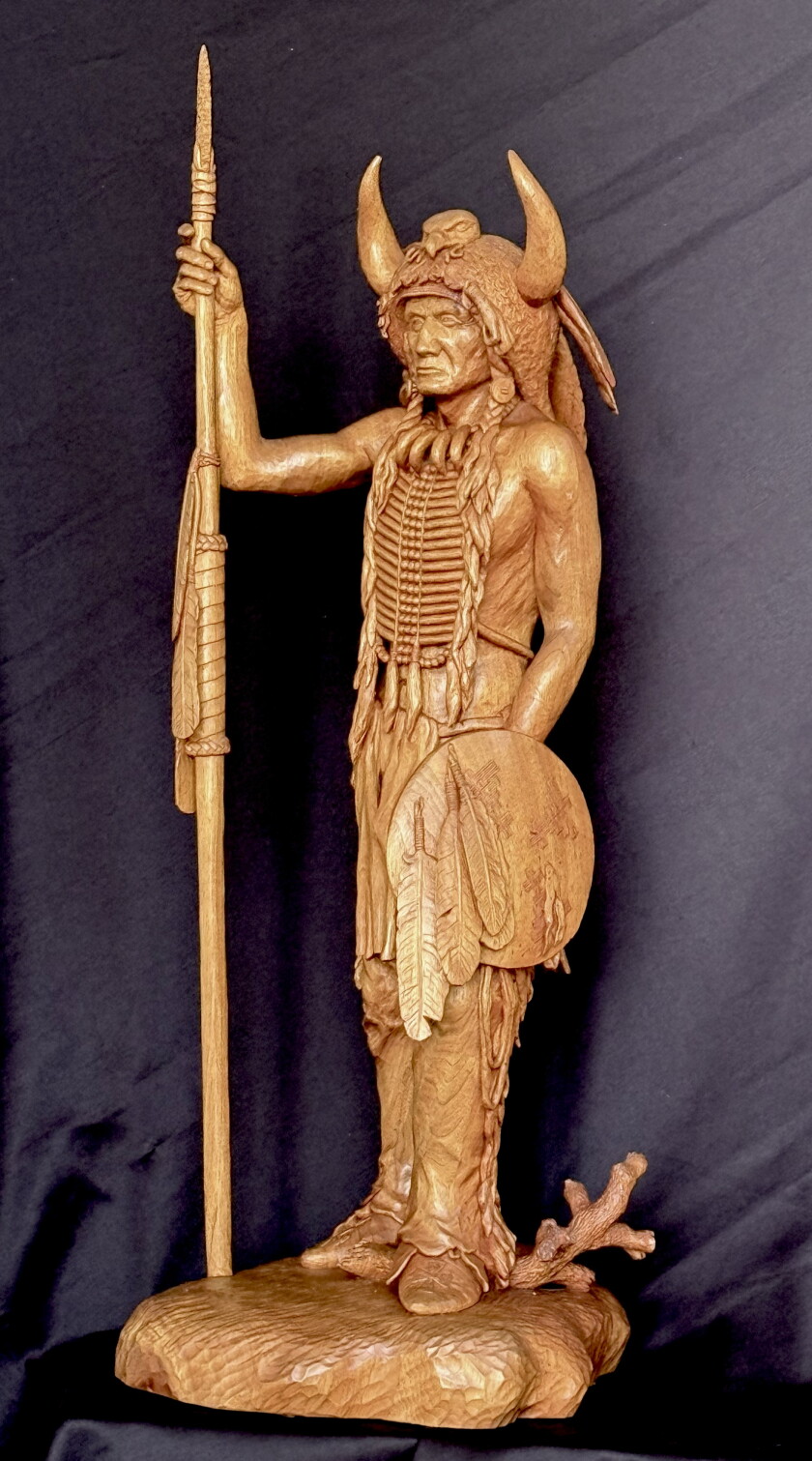 One of Fred Cogelow's earlier works from the early 1980's, a depiction of an Oglala Sioux warrior, "Dog Dies Running," marked an important step in his development as an artist. It was the sculpture that led him to believe in himself, Cogelow wrote in the 1991 book, "Sculptor in Wood The collected woodcarvings of Fred Cogelow" by Heart Prairie Press of Whitewater, Wisconsin.