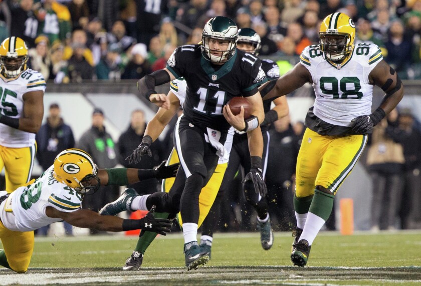 Nov 28, 2016; Philadelphia, PA, USA; Philadelphia Eagles quarterback Carson Wentz (11) and Green Bay Packers quarterback Aaron Rodgers (12) shake hands after a NFL football game at Lincoln Financial Field.The Packers defeated the Eagles 27-13. Mandatory Credit: Kirby Lee-USA TODAY Sports