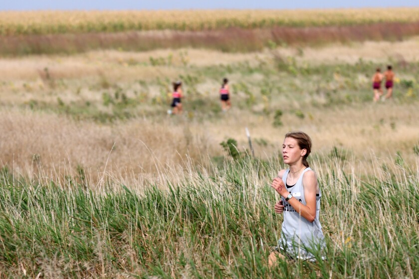 Murray County Central Warriors Amanda Overgaauw sets a demanding pace at the halfway point during Turkey Trot cross country race at the Worthington Regional Park Thursday evening.