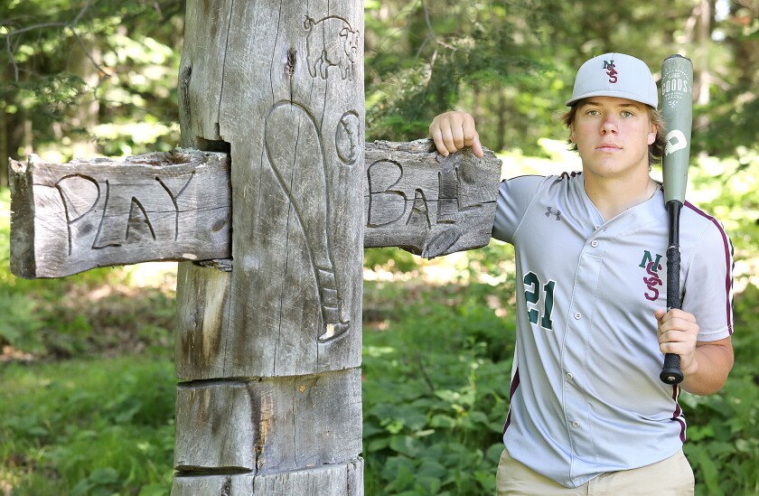 Northwood/Solon Springs’ Abe Ahlberg, the 2022 Superior Telegram baseball player of the year, stands by a pole in the backyard of his daycare provider, Gitzy Wicklund’s, home in Solon Springs