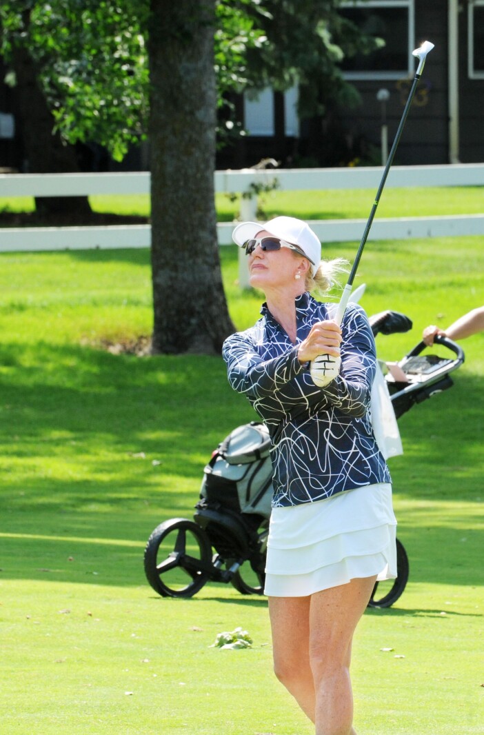 Jodi Sullivan watches her approach shot on the 11th hole during