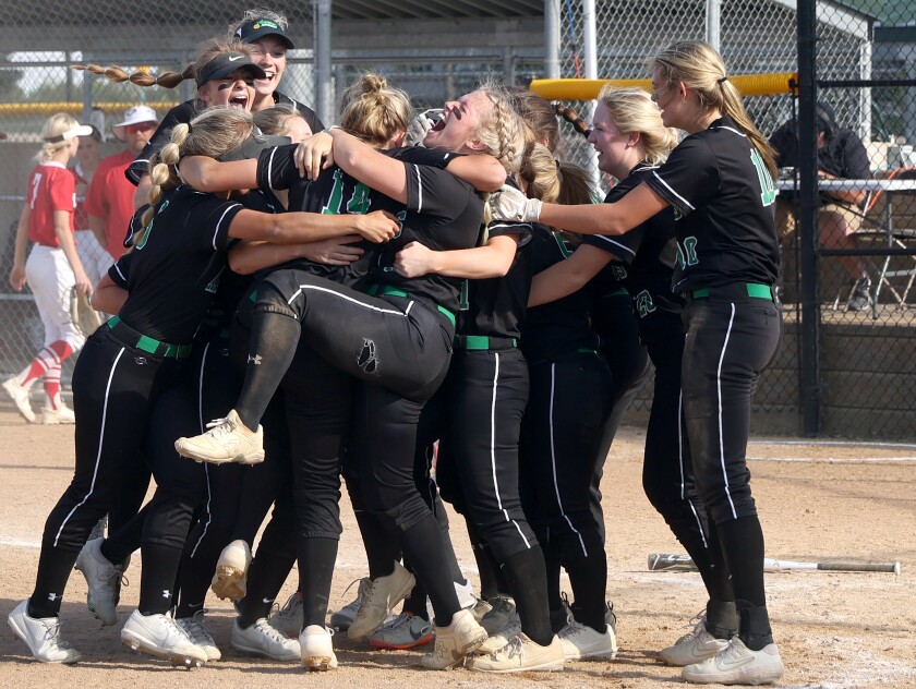 Pipestone Area Arrows celebrate after beating out Luverne Cardinals during Section 3AA softball championship Thursday in Marshall.