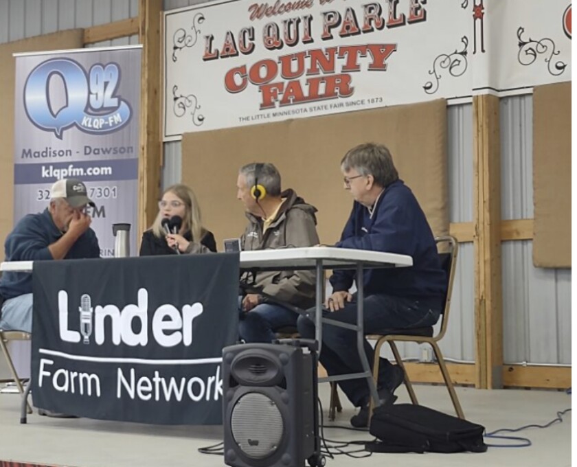 Maynard Meyer, far right, takes the stage for a live broadcast at the Lac qui Parle County Fair with Linder Farm Network's Lynn Ketelson.