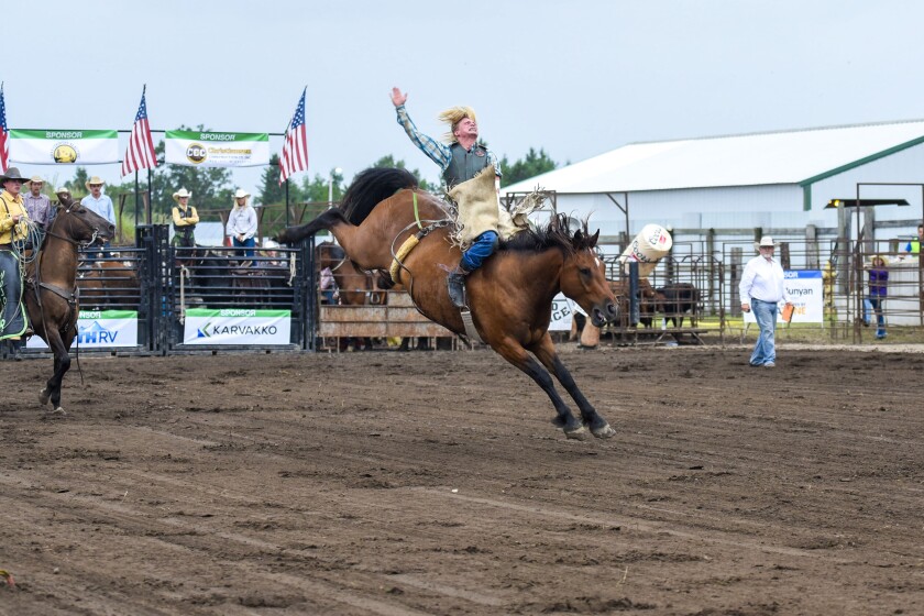 Photos: Fans, riders brave slight rain during Wojo's Rodeo at Beltrami ...
