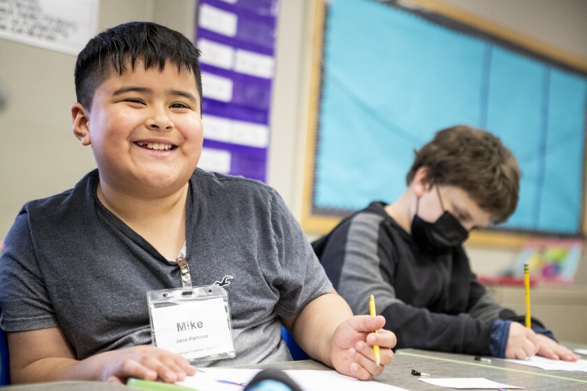 Fourth graders Michael Jaco Ramirez, from left, and Jaxson Schiesser complete an assignment related to bullying during a visit from the Ambassadors for Respect at Kennedy Elementary School on Thursday, May 5, 2022.