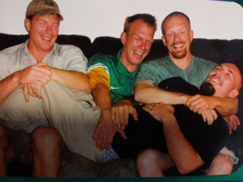 Four brothers on the couch.