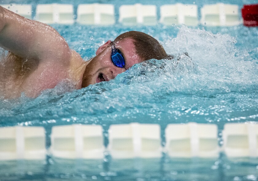Willmar senior Luke Lammers swims in the 100 freestyle