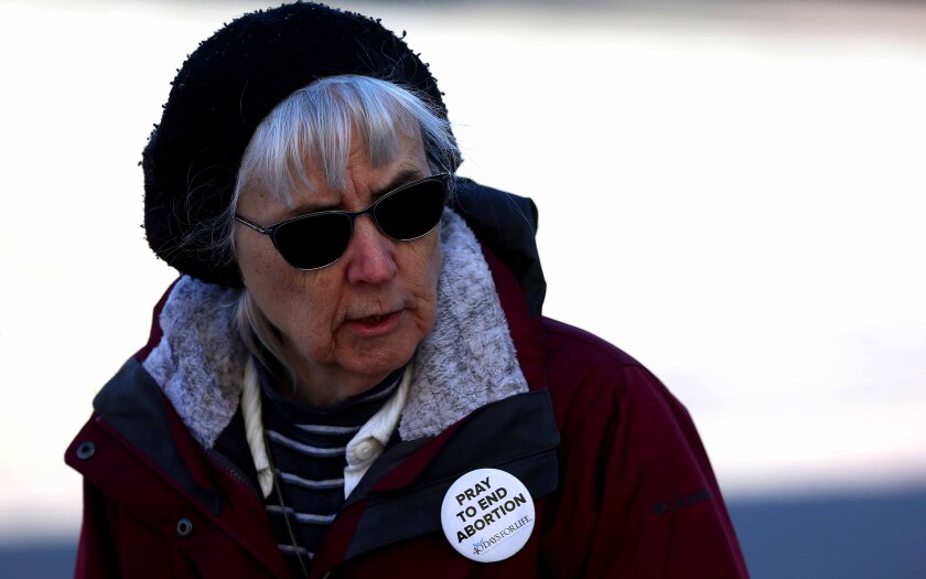 a lady wearing a button